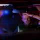 stressed man pulled over with police lights in back window