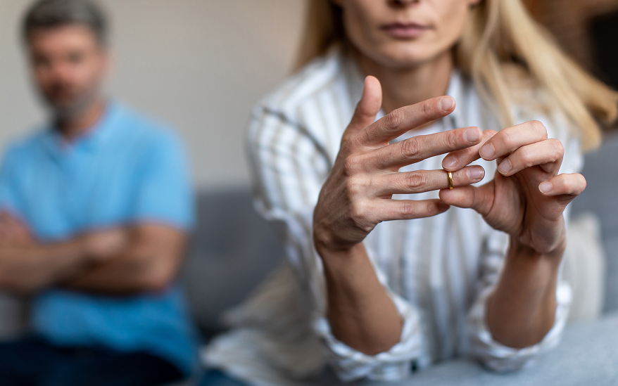 woman taking off ring