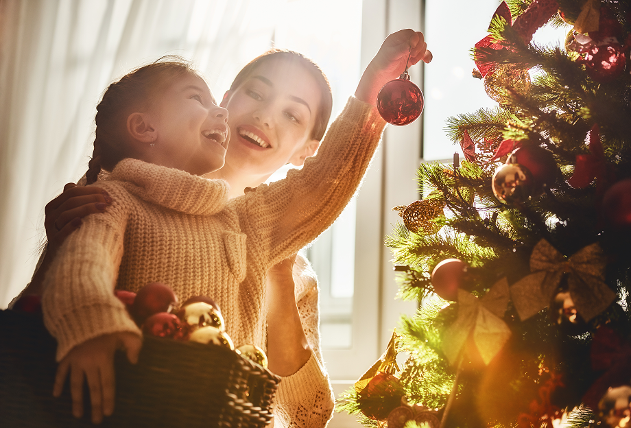 mother and daughter with Christmas trees