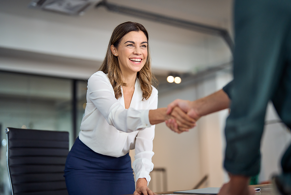 An attorney shaking hands with a client