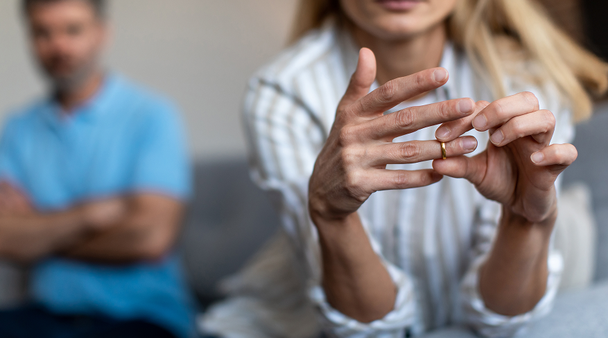 woman taking off ring